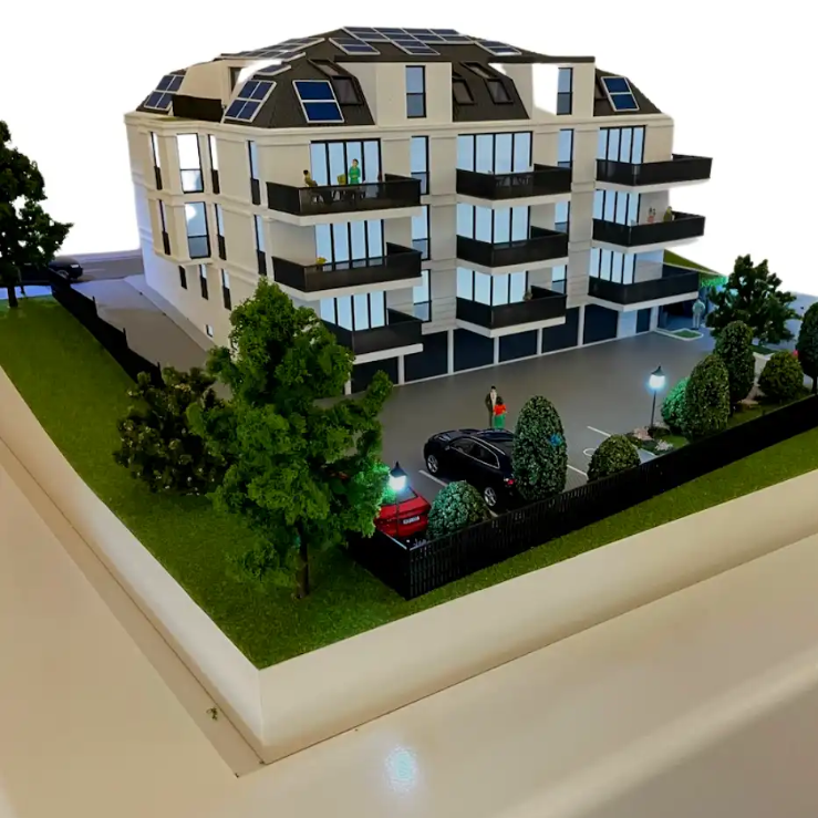Une maquette architecturale de haute précision, éclairée et animée, conçue par ARI Maquette et exposée au salon immobilier MIPIM. Elle intègre un éclairage intérieur et extérieur, des éléments en mouvement et un aménagement paysager réaliste. Elle ca