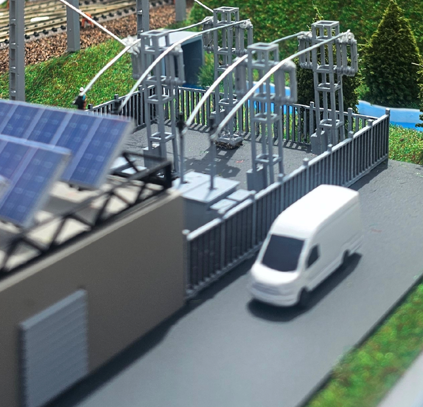 Maquette urbaine éclairée et animée par ARI Maquette, représentant les flux de mobilité, les réseaux logistiques de quartier et les infrastructures durables pour les exposants du Urban Logistics Summit.